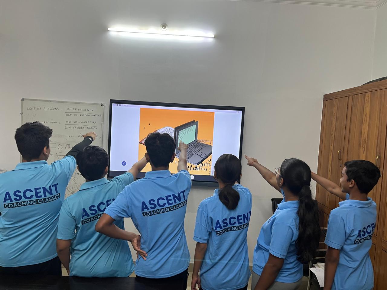 Students interacting with digital content at Ascent Coaching Classes