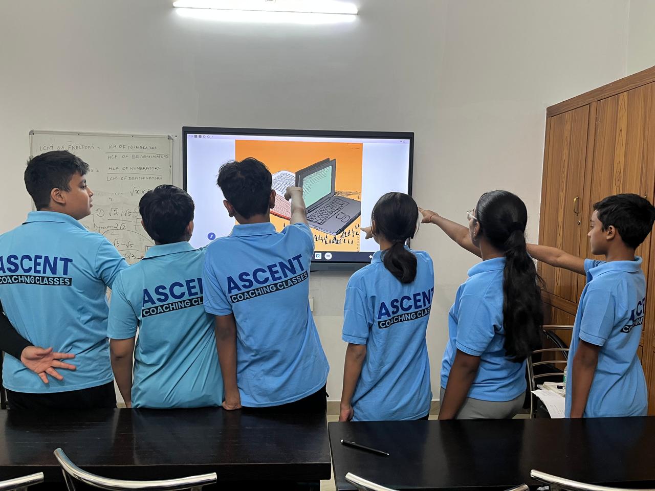 Students using digital learning resources at Ascent Coaching Classes